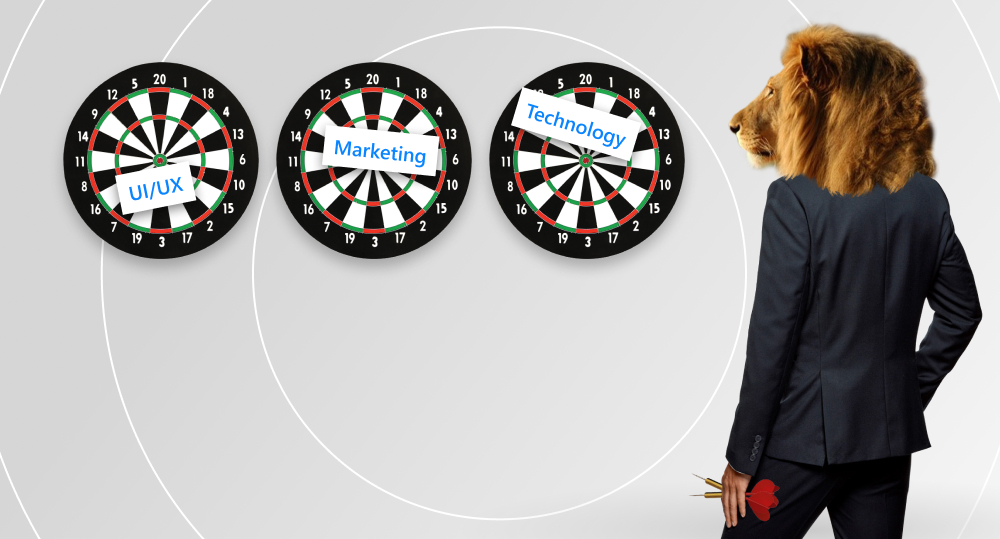 Lion holds two darts in its paw and stands in front of three targets for darts. On first target, there’s piece of paper with inscription “UI / UX”, on second - “Marketing”, on third - “Technology”.