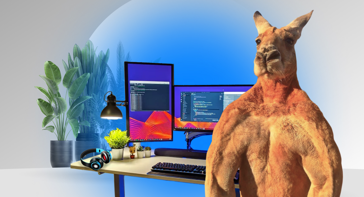 Muscular kangaroo standing by its desktop computer and asking readers how to hire dedicated backend developers