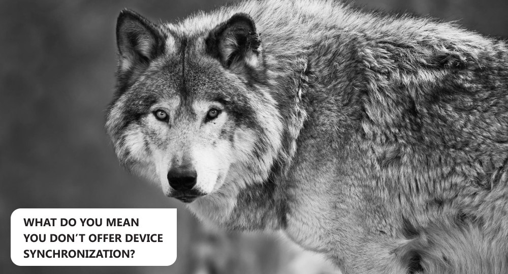 Black and white picture of wolf that is sad because a saas company doesn’t offer device synchronization.