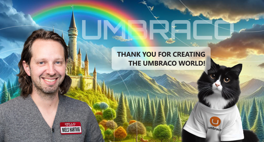 Cat wearing t-shirt with Umbraco logo thanks Niels Hartvig for creating Umbraco with picturesque landscape as backdrop